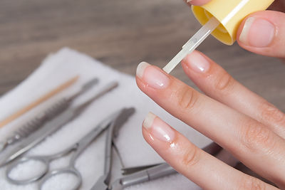Apply oil to the cuticle. Manicure, nail